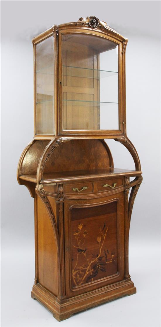 A Louis Majorelle Chicoree pattern oak and marquetry display cabinet, W.3ft 3in. D.1ft 5in. H.7ft 5in.